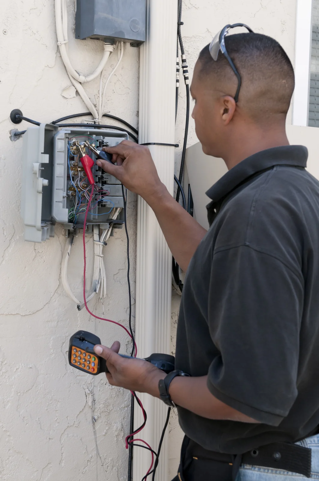 Technician Fixing Panel